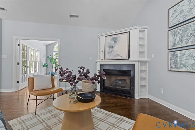 a living room with furniture and a fireplace