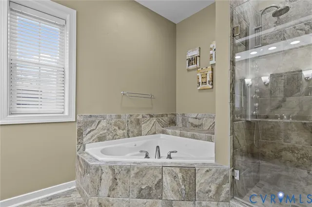 a bath tub sitting next to a shower