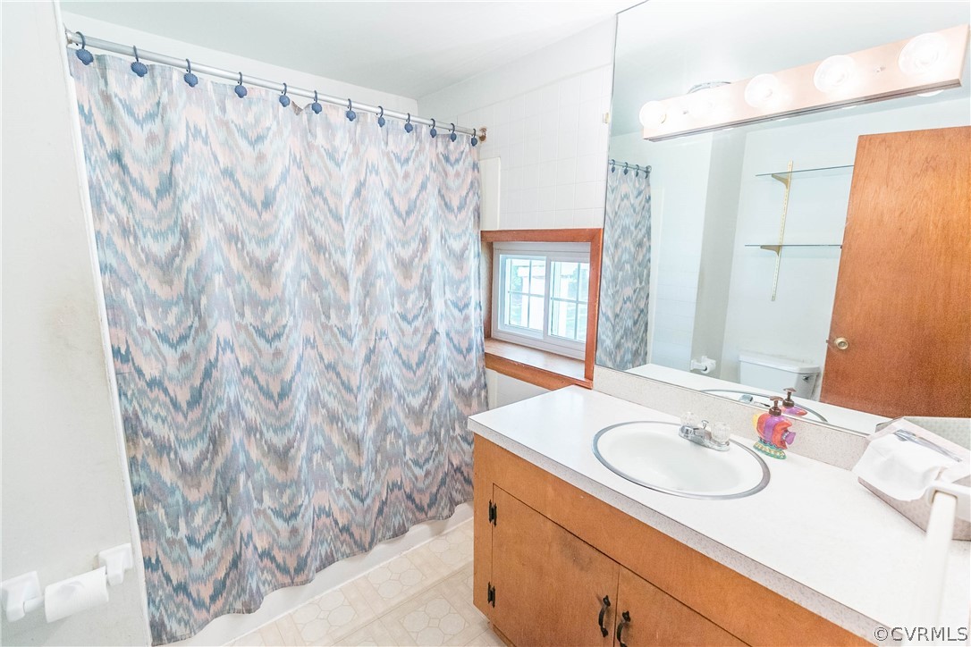 7339 Strath Road Henrico, VA 23231 - Photo 19 of 50 a bathroom with a sink and a mirror