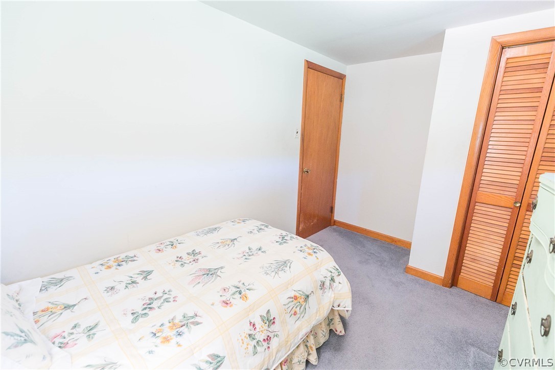 7339 Strath Road Henrico, VA 23231 - Photo 23 of 50 a bedroom with a bed and a window