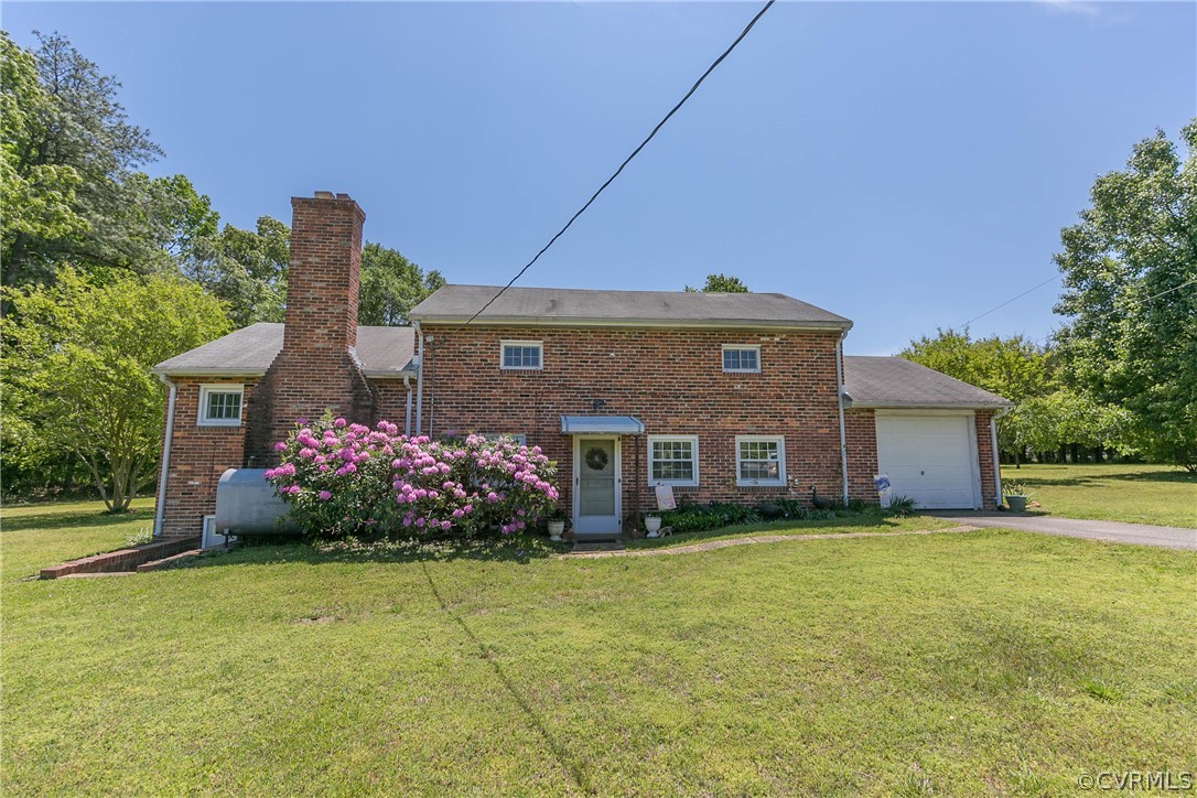 7339 Strath Road Henrico, VA 23231 - Photo 34 of 50 a front view of a house with a garden