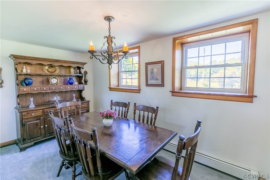 7339 Strath Road Henrico, VA 23231 - Photo 6 of 50 a view of a dining room with furniture and chandelier