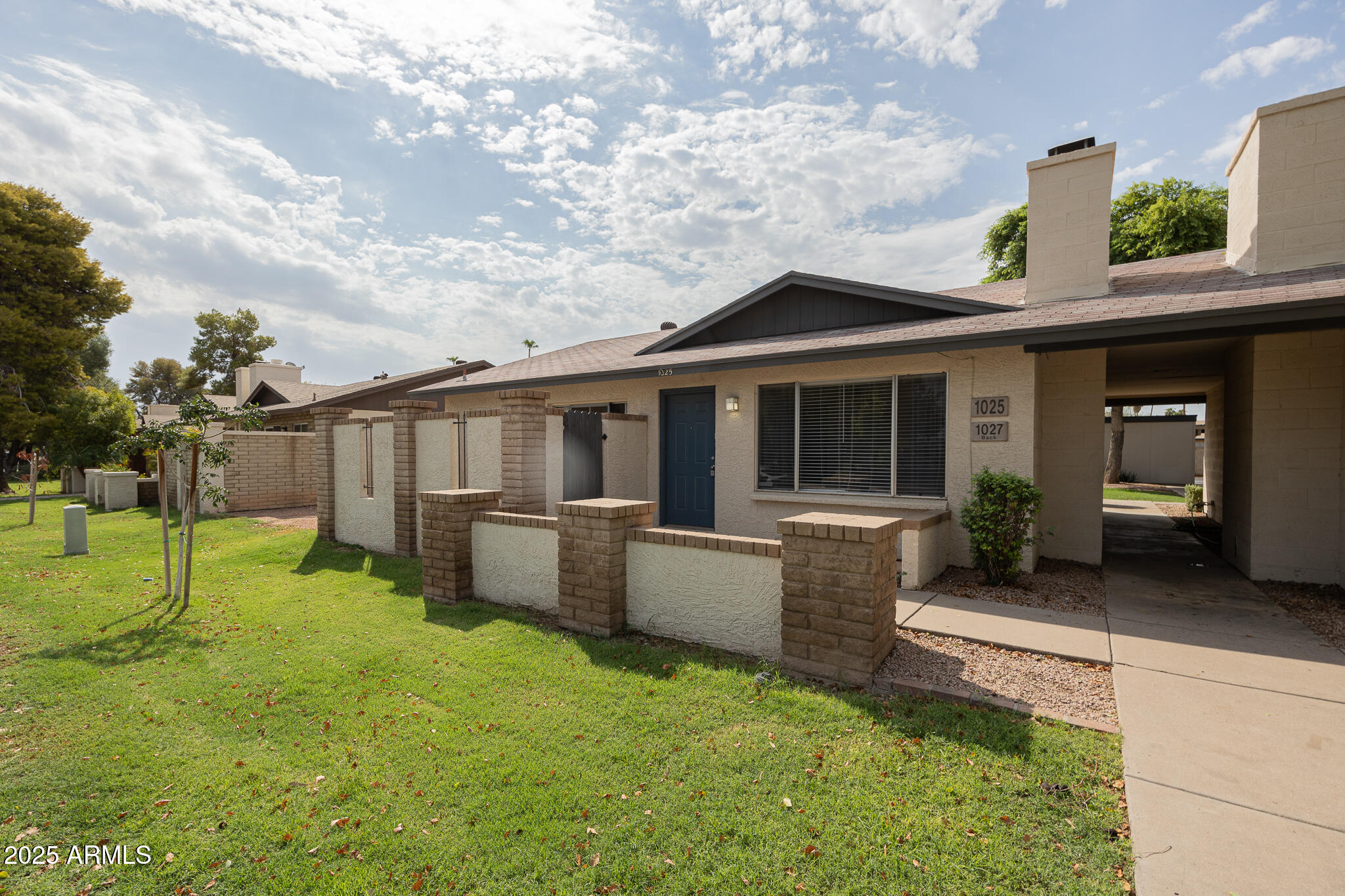 1025 West Laguna Drive Tempe, AZ 85282 - Photo 1 of 20 a view of a house with backyard and porch