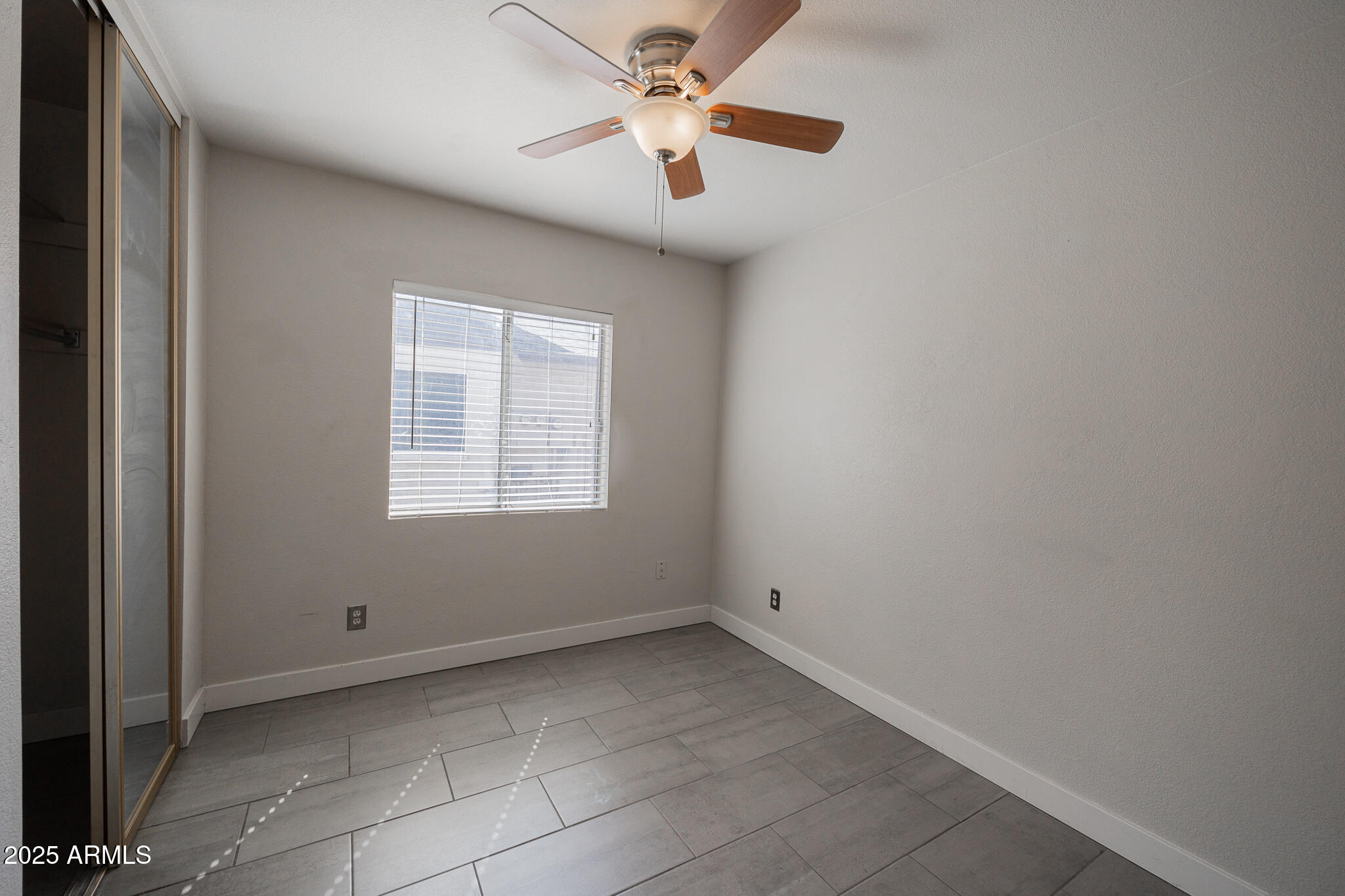 1025 West Laguna Drive Tempe, AZ 85282 - Photo 16 of 20 a view of an empty room with a window