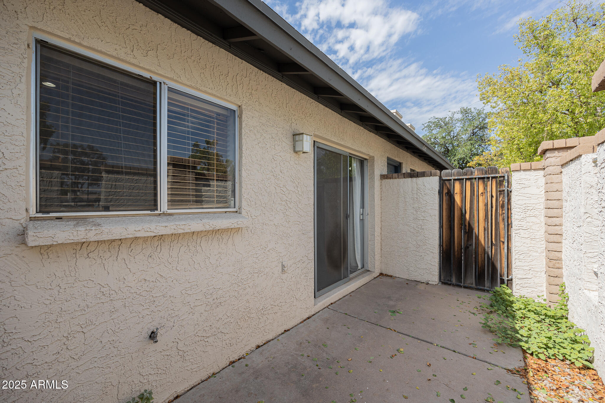 1025 West Laguna Drive Tempe, AZ 85282 - Photo 20 of 20 a view of house with window and yard
