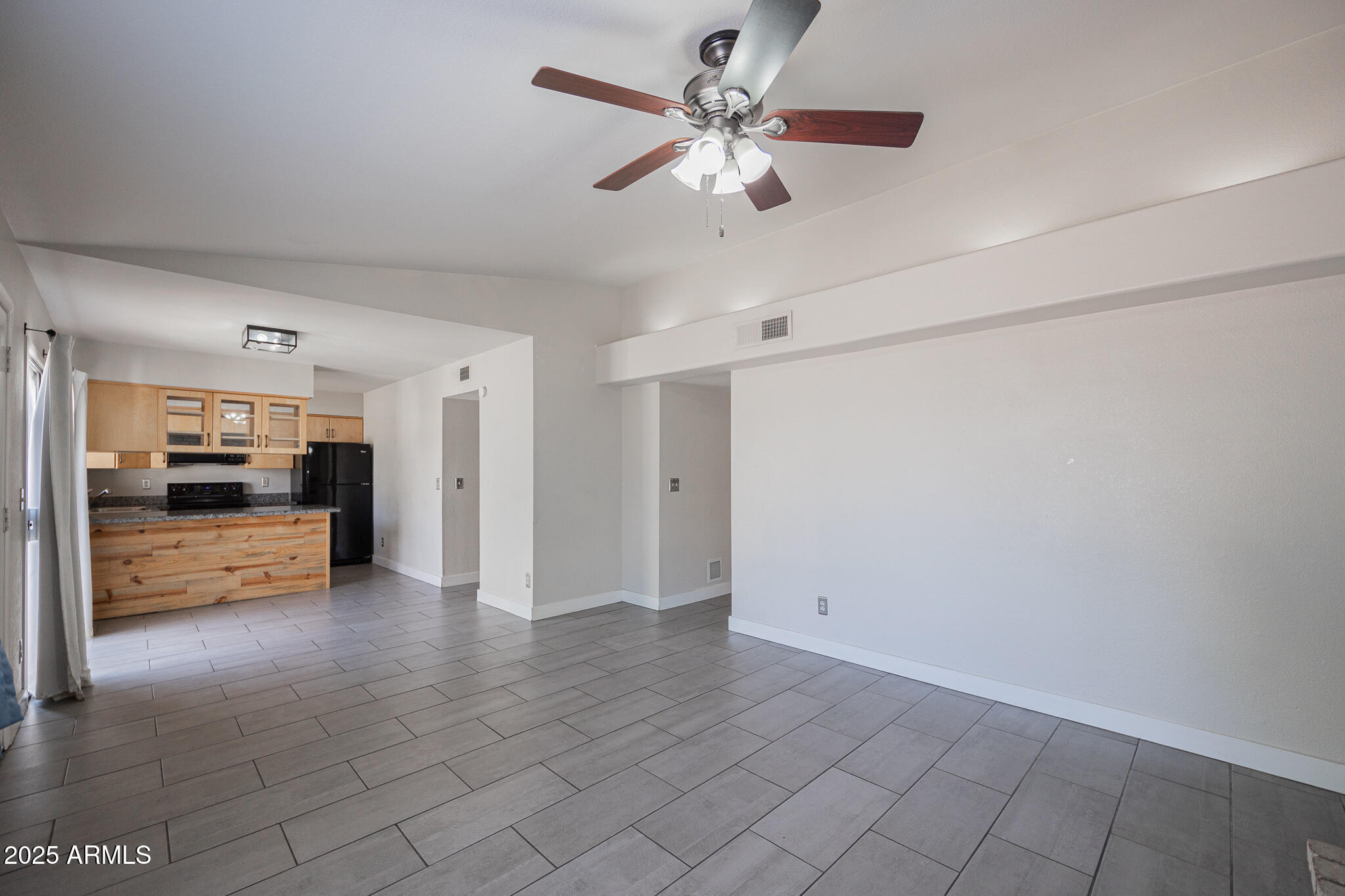 1025 West Laguna Drive Tempe, AZ 85282 - Photo 6 of 20 a view of a hallway with cabinet and a chandelier
