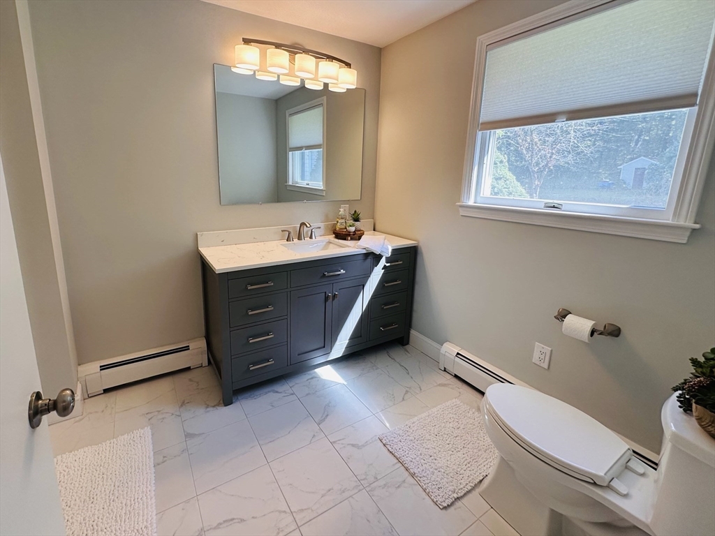 1107 Jackson Road Hardwick, MA 01037 - Photo 11 of 41 a bathroom with a toilet sink and mirror