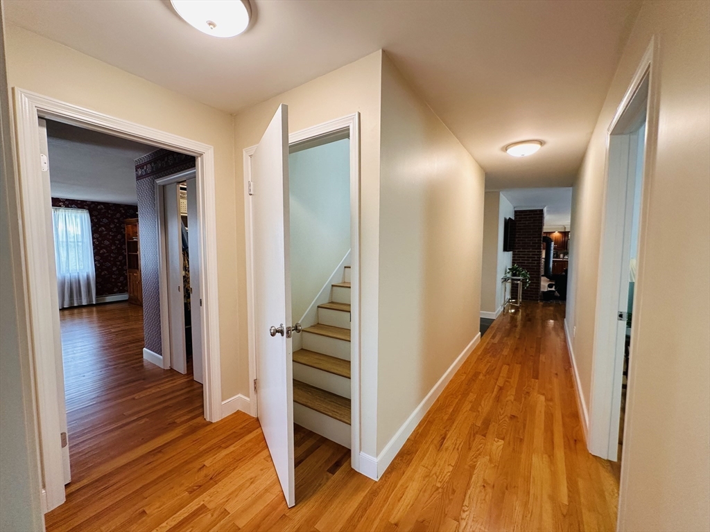 1107 Jackson Road Hardwick, MA 01037 - Photo 29 of 41 a view of a hallway with wooden floor and stairs
