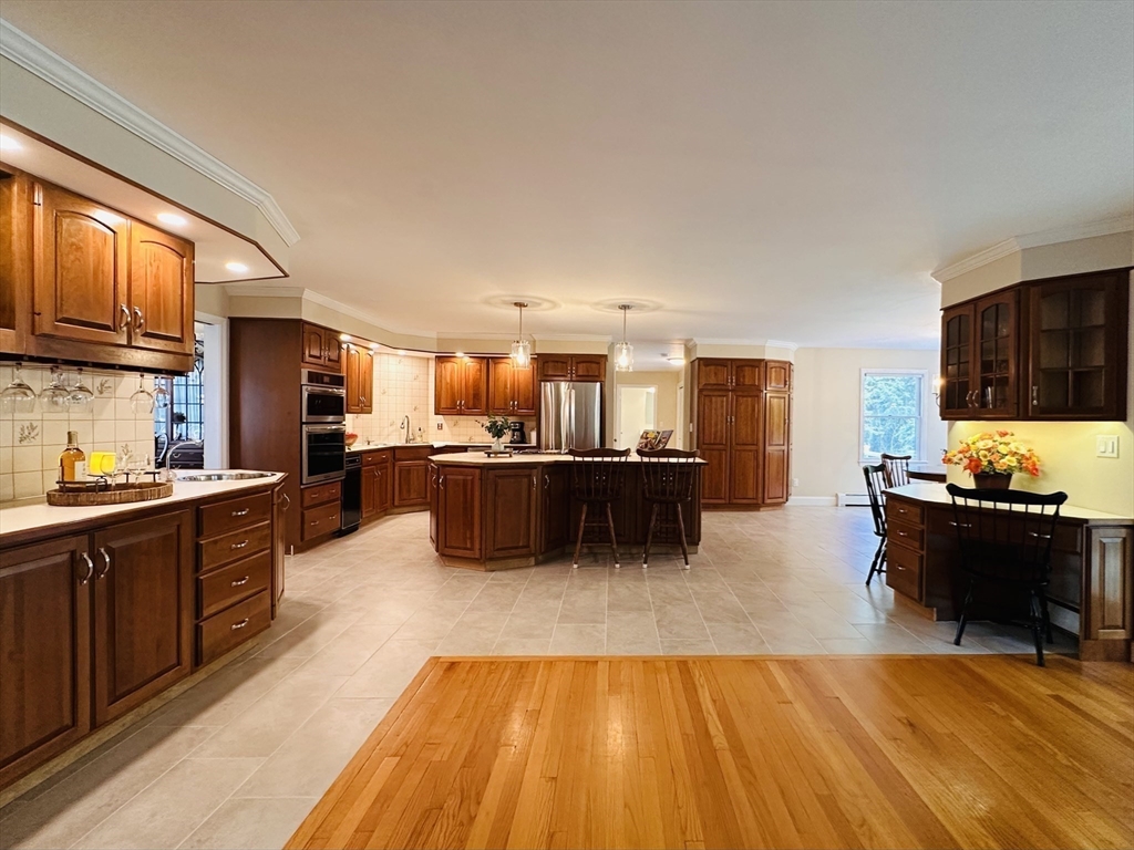 1107 Jackson Road Hardwick, MA 01037 - Photo 8 of 41 a large kitchen with kitchen island a stove a sink dishwasher and a microwave oven with cabinets