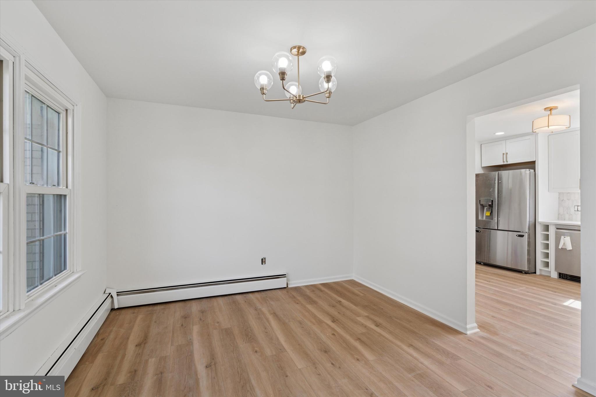 227 Spohn Road Reading, PA 19608 - Photo 7 of 21 a view of an empty room with wooden floor and a window