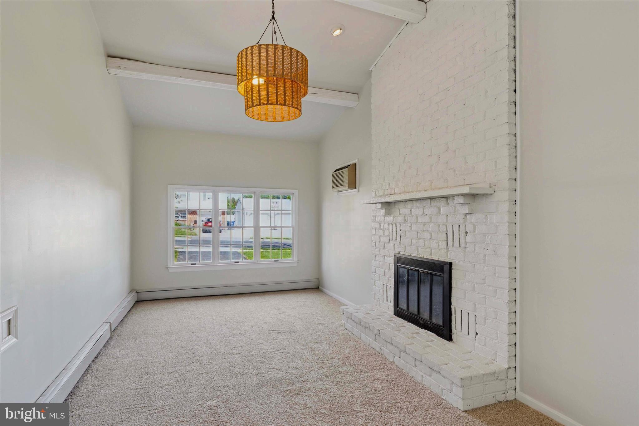 227 Spohn Road Reading, PA 19608 - Photo 8 of 21 an empty room with windows and fireplace