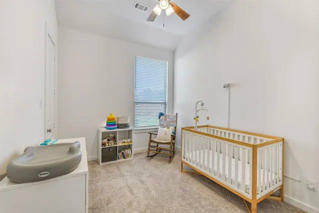 a bedroom with furniture and a window