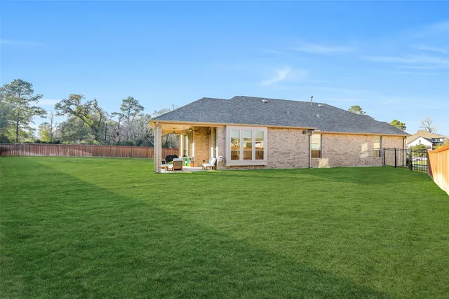 a view of a big house with a big yard