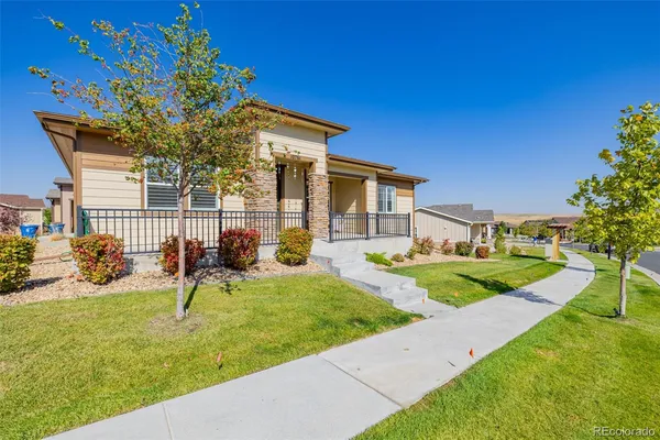 a view of a house with backyard porch and sitting area