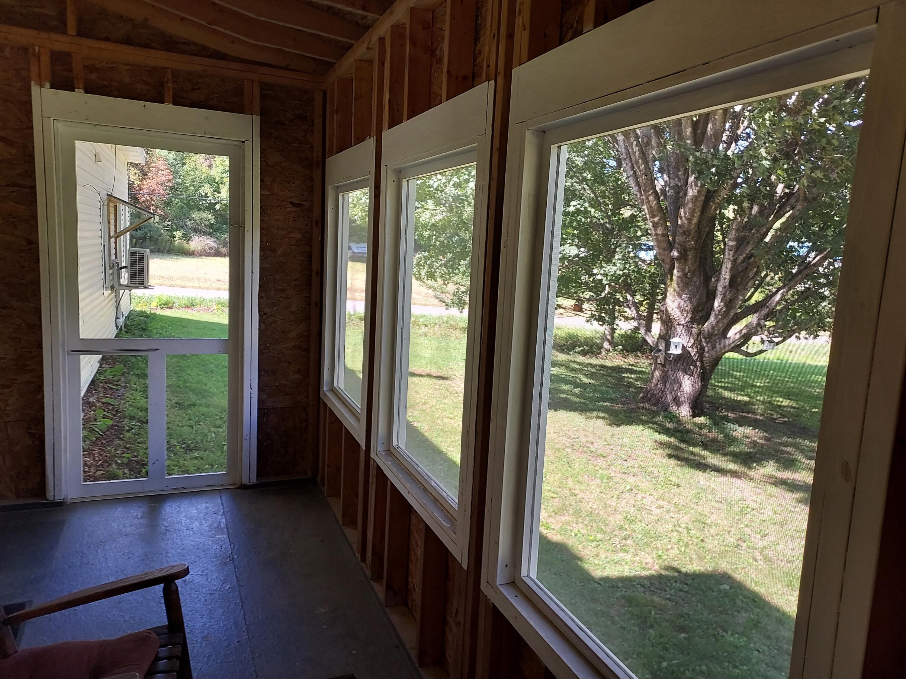 96 Exeter Road Garland, ME 04939 - Photo 19 of 58 Screened Porch door to side yard