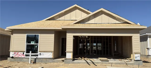 a front view of a house with parking