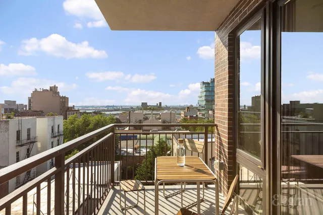 a bedroom with a large bed and a large window