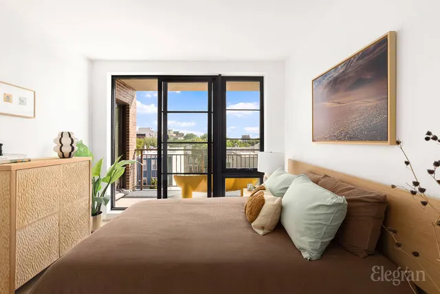 a bathroom with a double vanity sink mirror and shower