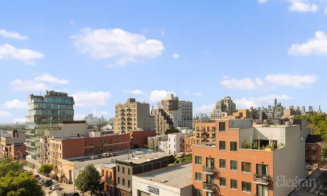 a balcony with furniture and city view