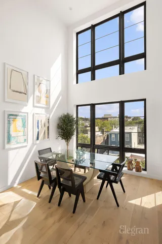 a view of a dining room with furniture window and outside view