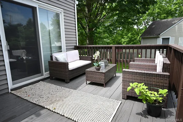 a view of a balcony with furniture