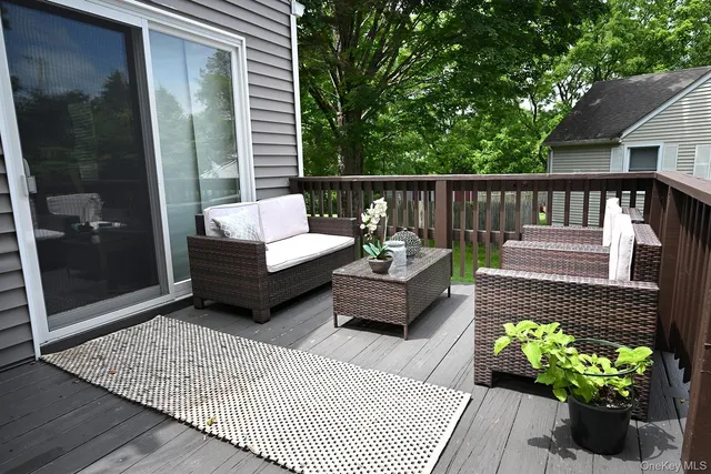 a view of a balcony with furniture