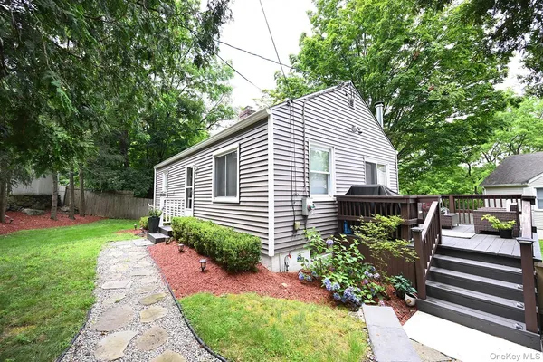 a view of a house with a yard and plants