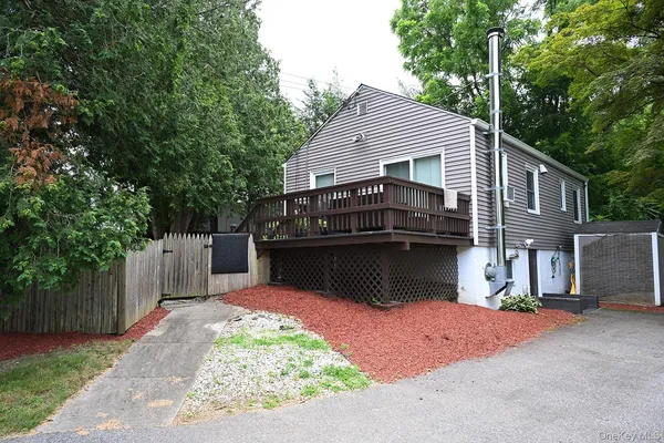 a backyard of a house with wooden fence