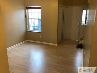16 Renaissance Lane New Brunswick, NJ 08901 - Photo 1 of 18 an empty room with windows