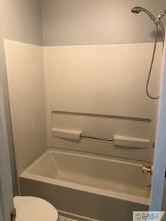 16 Renaissance Lane New Brunswick, NJ 08901 - Photo 15 of 18 a bathroom with a shower and a toilet