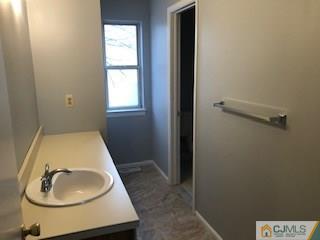 16 Renaissance Lane New Brunswick, NJ 08901 - Photo 17 of 18 a bathroom with a sink toilet and vanity