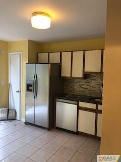 16 Renaissance Lane New Brunswick, NJ 08901 - Photo 3 of 18 a kitchen with stainless steel appliances granite countertop a refrigerator and a sink