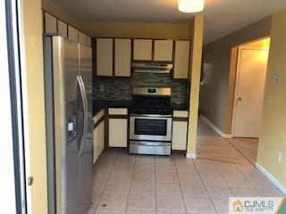 16 Renaissance Lane New Brunswick, NJ 08901 - Photo 4 of 18 a kitchen with stainless steel appliances granite countertop a refrigerator and a sink