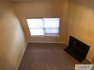 16 Renaissance Lane New Brunswick, NJ 08901 - Photo 5 of 18 a view of an empty room with a window