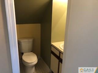 16 Renaissance Lane New Brunswick, NJ 08901 - Photo 7 of 18 a bathroom with a sink and a toilet