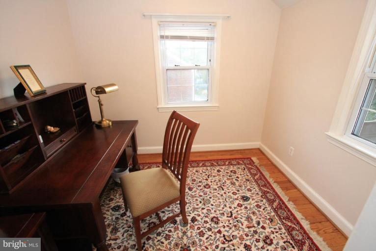 9924 Grayson Avenue Silver Spring, MD 20901 - Photo 4 of 26 a view of workspace with wooden floor windows