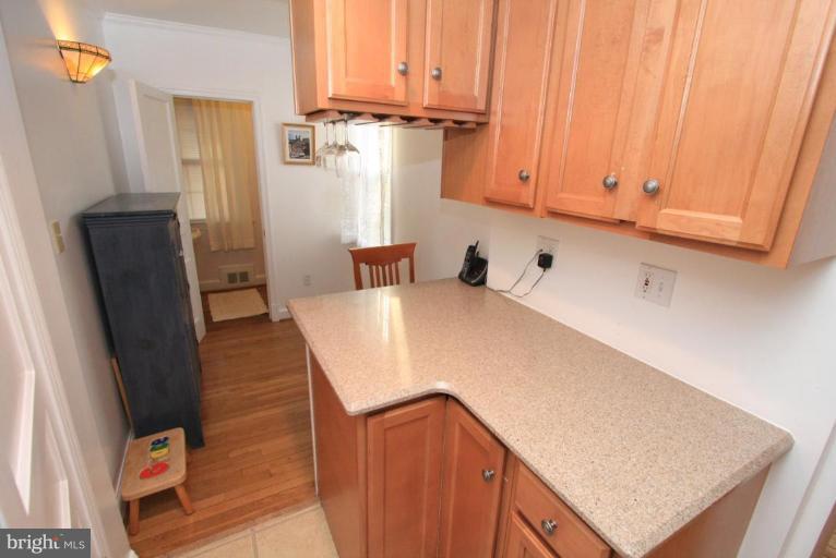 9924 Grayson Avenue Silver Spring, MD 20901 - Photo 7 of 26 a view of kitchen and wooden floor