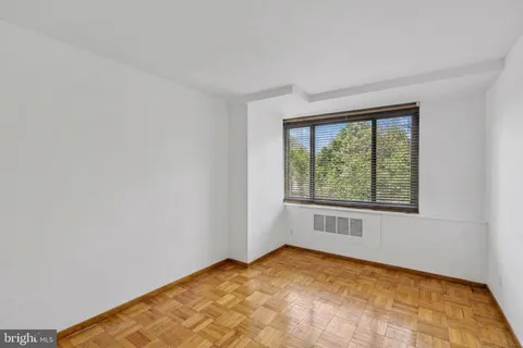 a view of a livingroom with furniture and a window