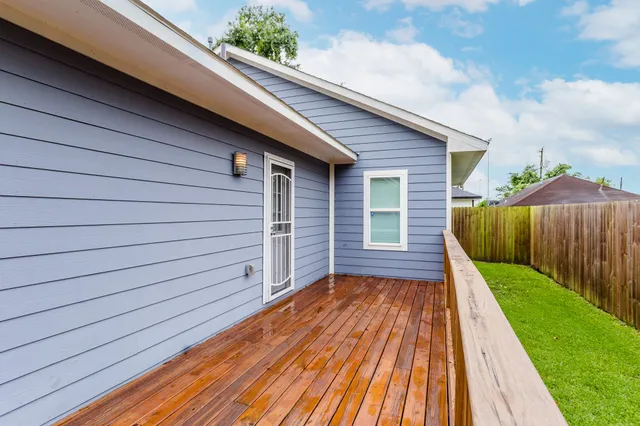 a view of a backyard with wooden floor