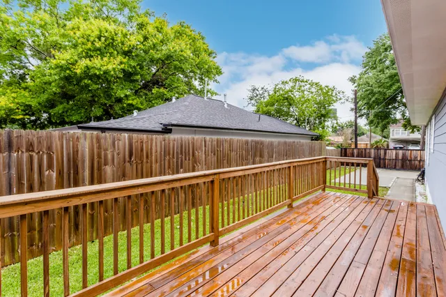 a view of balcony with deck and wooden floor