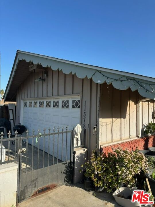 11578 Flower Street Riverside, CA 92505 - Photo 8 of 20 a front view of a house with garden