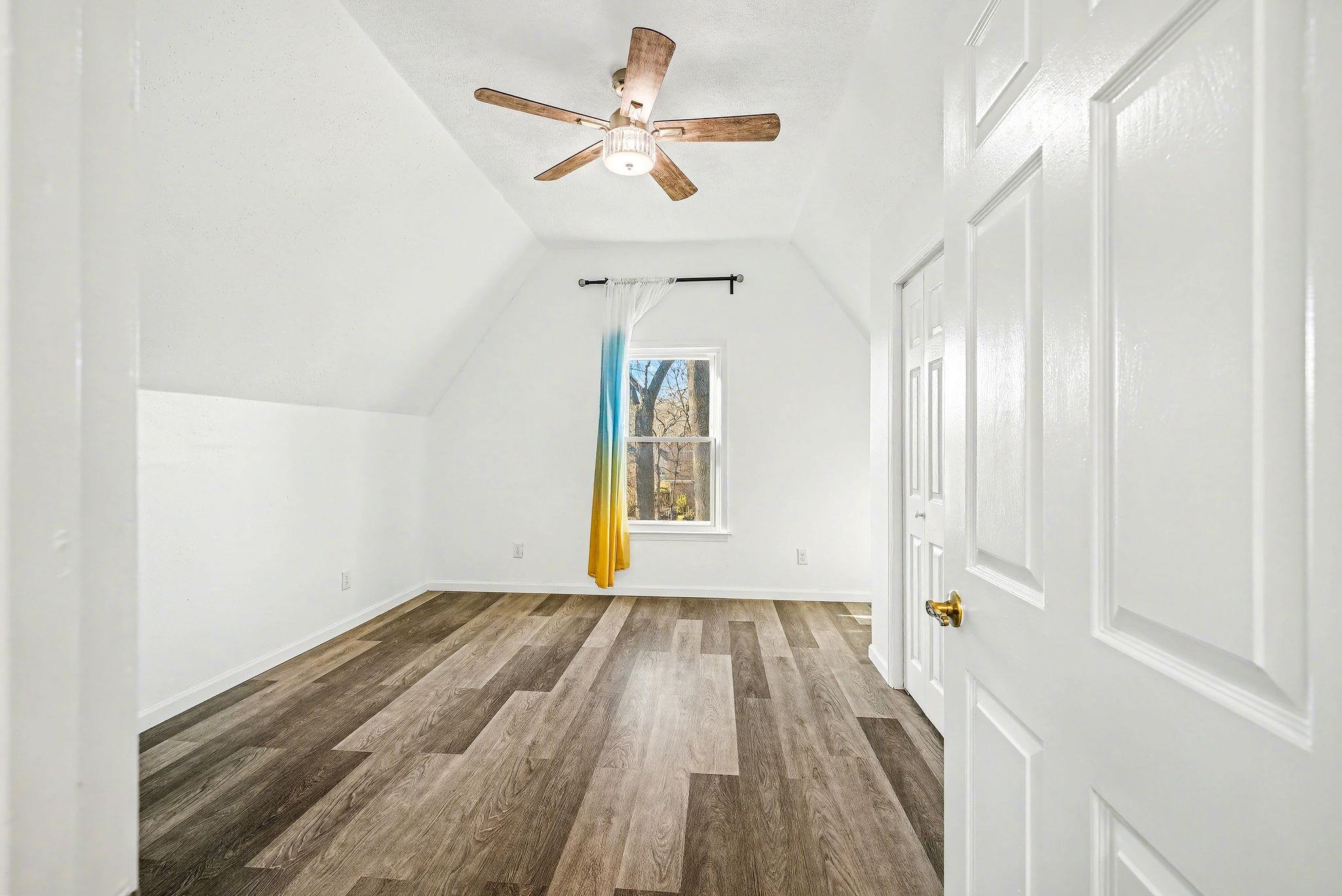 8431 Bazemore Road Cordova, TN 38018 - Photo 18 of 23 Bedroom 5, featuring lofted ceiling, wood finished floors, and a ceiling fan