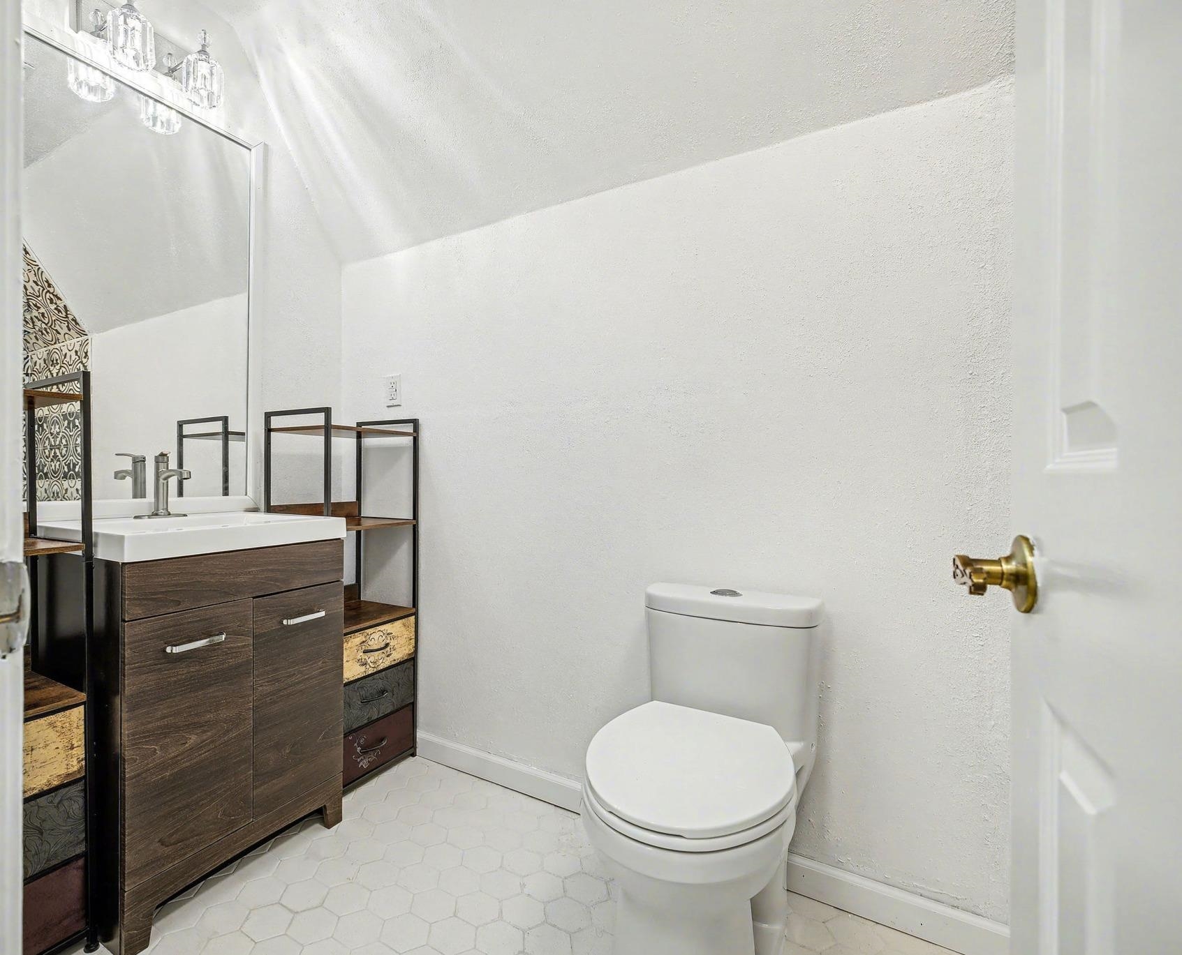 8431 Bazemore Road Cordova, TN 38018 - Photo 19 of 23 Bathroom with vanity and vaulted ceiling