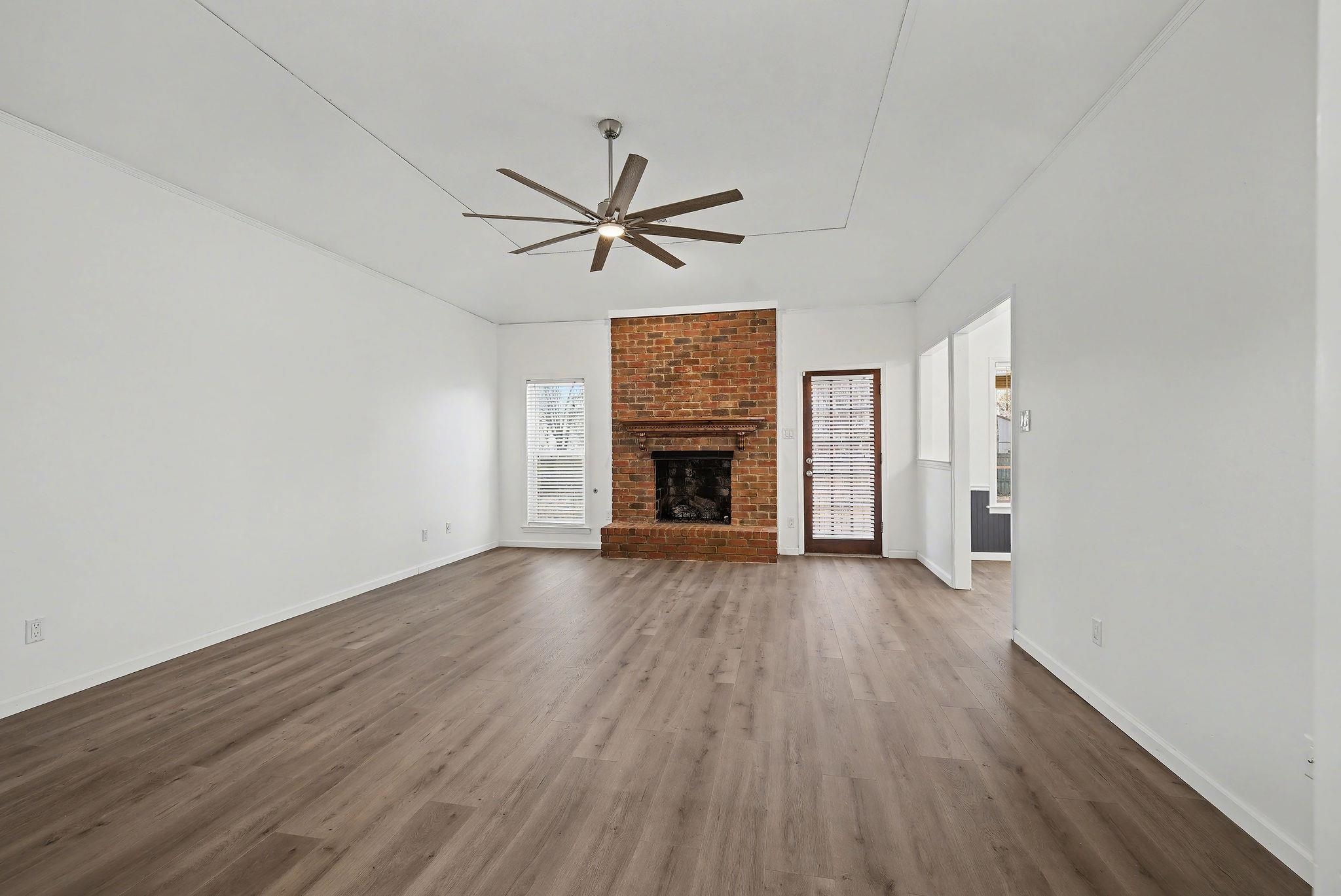 8431 Bazemore Road Cordova, TN 38018 - Photo 6 of 23 Large living room with a gas fireplace, a ceiling fan, and vaulted ceiling.
