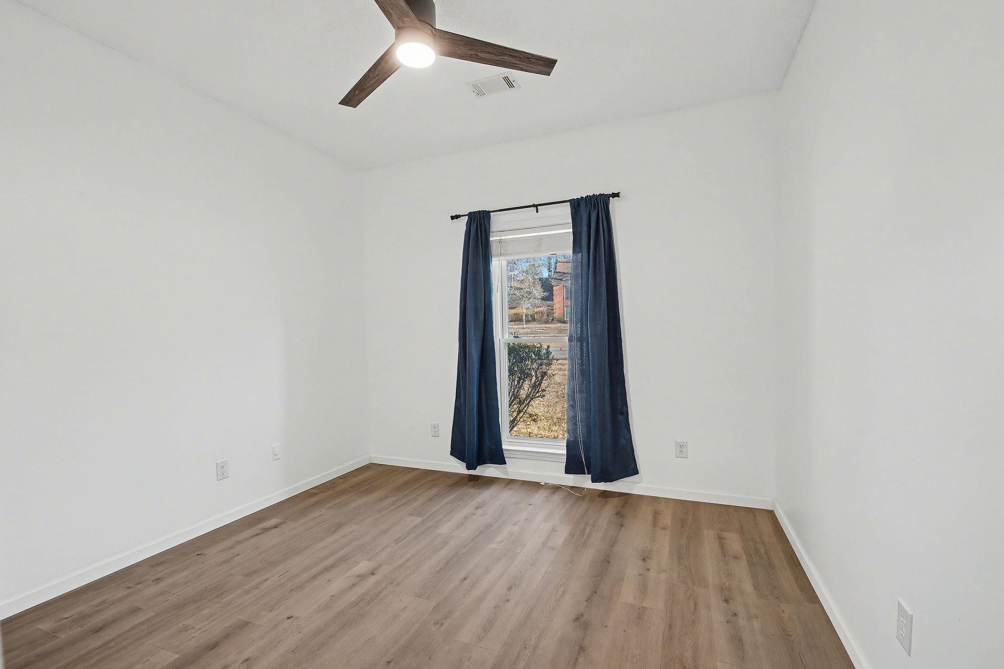 8431 Bazemore Road Cordova, TN 38018 - Photo 8 of 23 Front facing bedroom with aromatic cedar flooring in the closet.