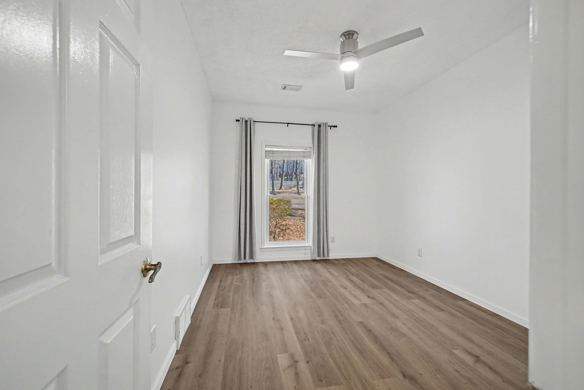 8431 Bazemore Road Cordova, TN 38018 - Photo 9 of 23 Front facing bedroom with aromatic cedar flooring in the closet.