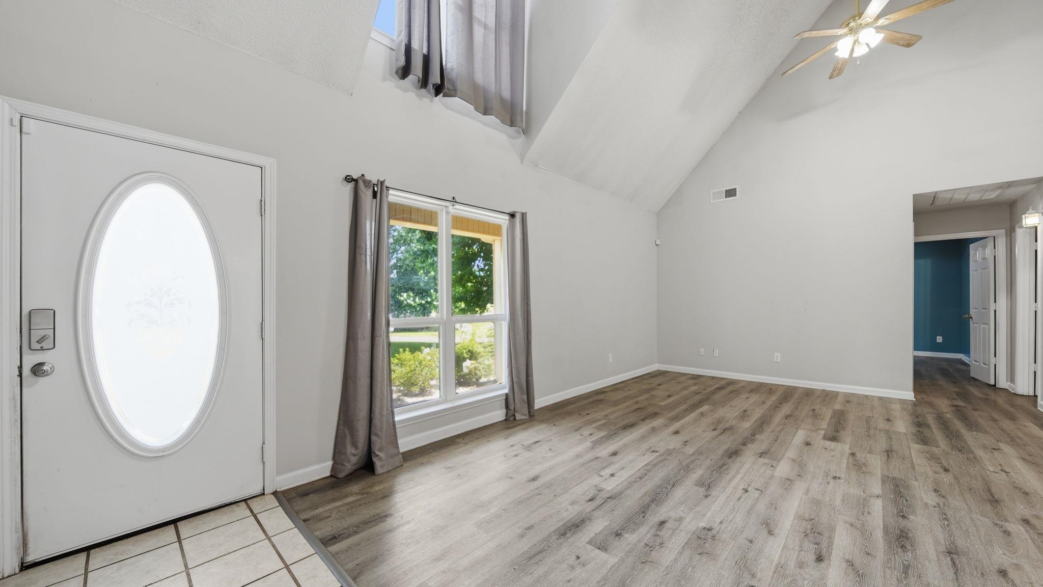 217 Rae Drive Munford, TN 38058 - Photo 6 of 40 Spacious Great Room room featuring vaulted ceilings, wood-finish flooring, and a ceiling fan