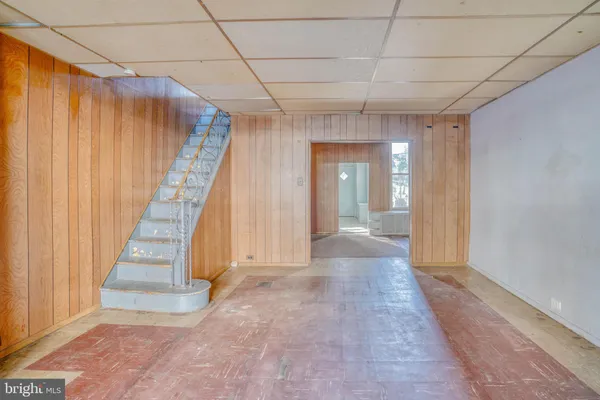 a view of a hallway with staircase
