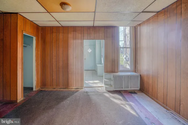 a view of a bathroom with a tub and shower curtain