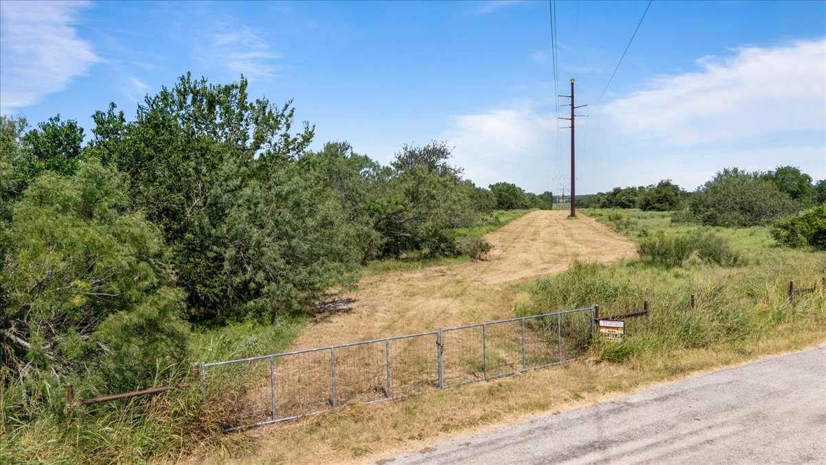 0 Hidden Shores Road Smithville, TX 78957 - Photo 7 of 28 a view of a road with a tree in the background